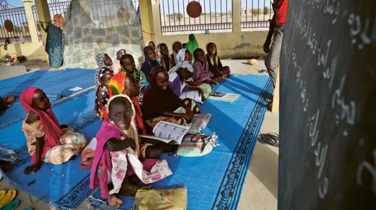 Sudanese children attend a class in a madrasa at the Gaga Refugee Camp, Republic of Chad, 17 June 2014