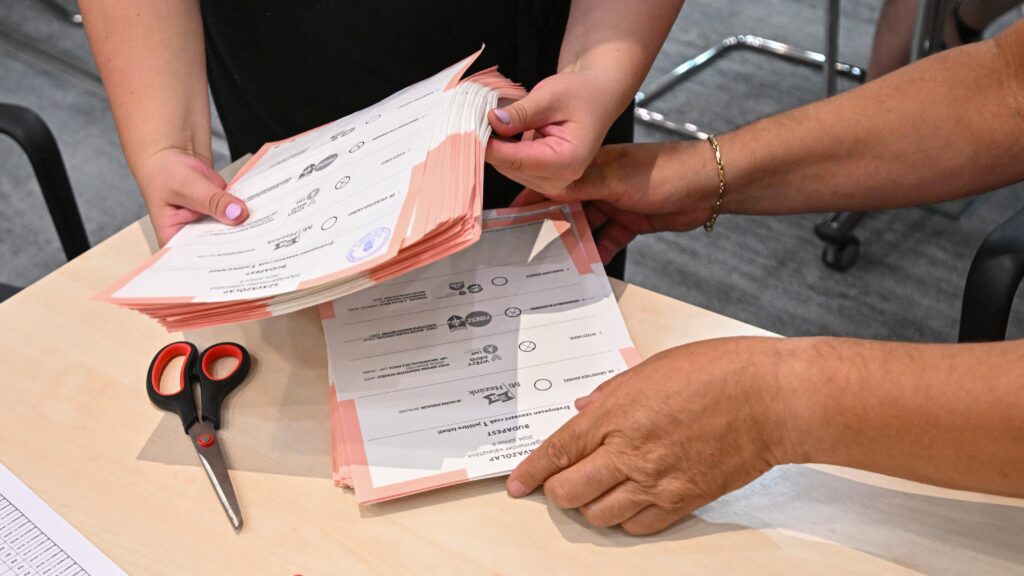 Officials and activists recount the ballots of the mayoral election in the office of the mayor of the city's 12th district in Budapest, Hungary on July 11, 2024.